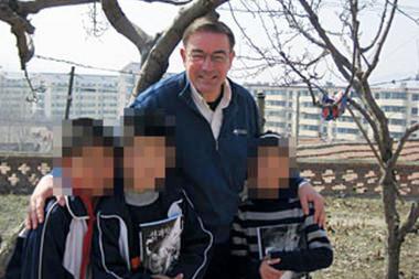 Rev. Tim Peters poses with both North Korean and Chinese children